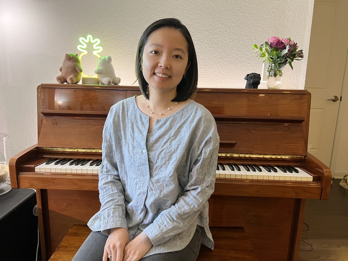 Iris Lin at the piano in her Vista studio